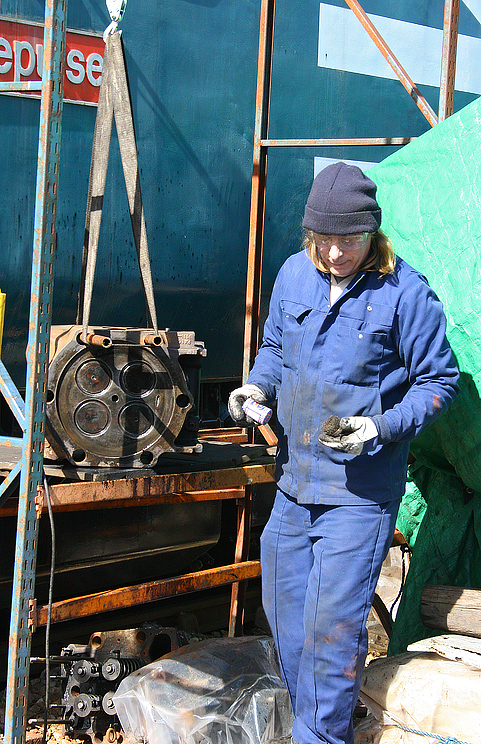 Dave Rolfe with a cylinder head on the hoist